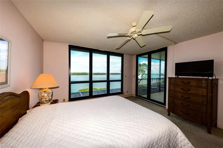 OWNER'S SUITE.  ENTRANCE TO LIVING AREA IS TO RIGHT.