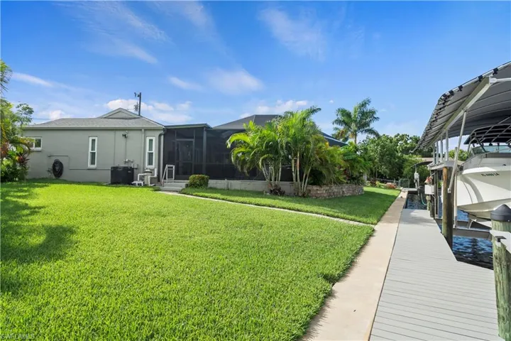 View of yard featuring a boat dock