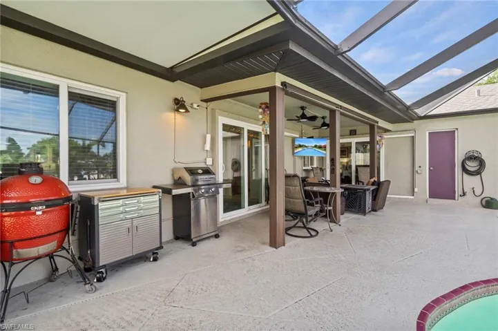 View of terrace featuring a grill and ceiling fan