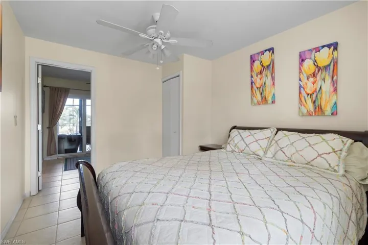 Bedroom featuring tile flooring and ceiling fan