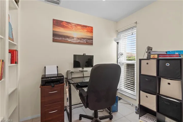 Office with light tile floors