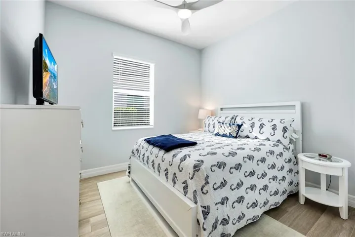 Guest bedroom privately tucked away on the western side of the home, away from the primary.