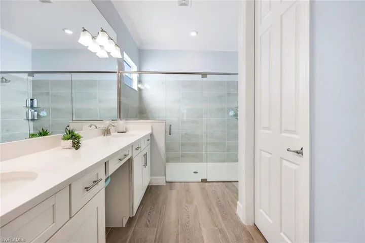 Quartz countertops, double sinks and custom lighting.
