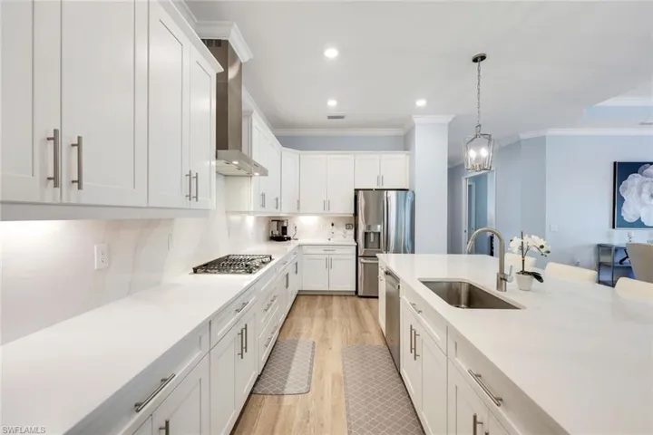 Abundant cabinetry, gas cooktop and expansive counter space.