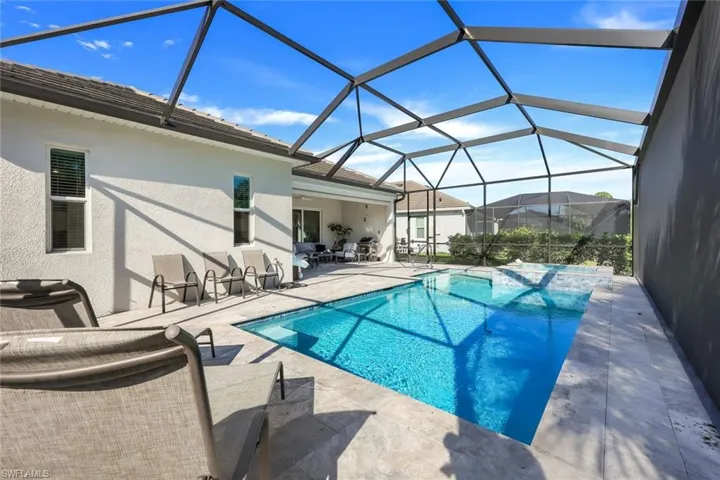 Long view of the pool and lanai.