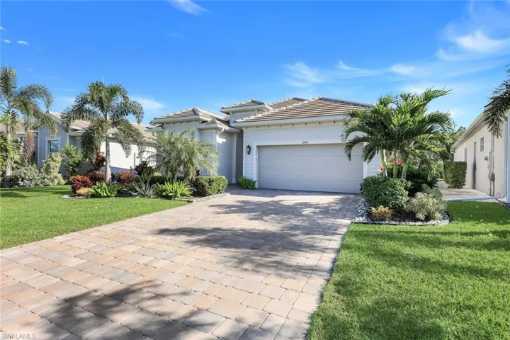 Beautiful front exterior with lush landscaping and great curb appeal.