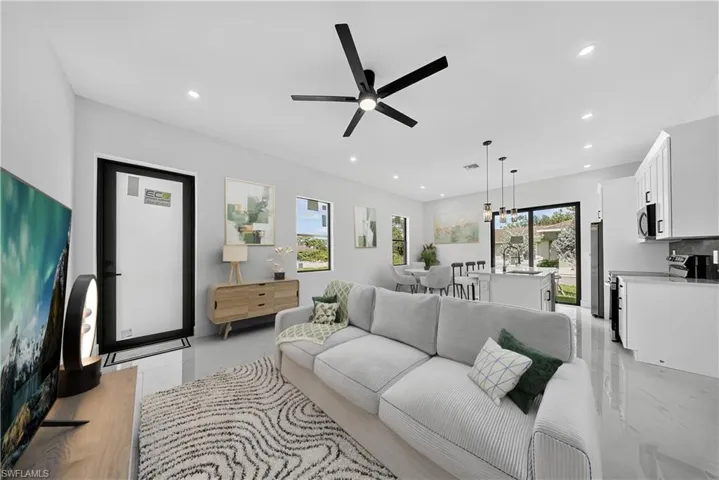 Living room featuring recessed lighting and ceiling fan