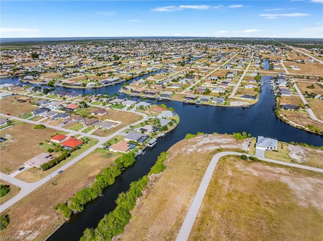 Aerial view of residential area with a nearby body of water