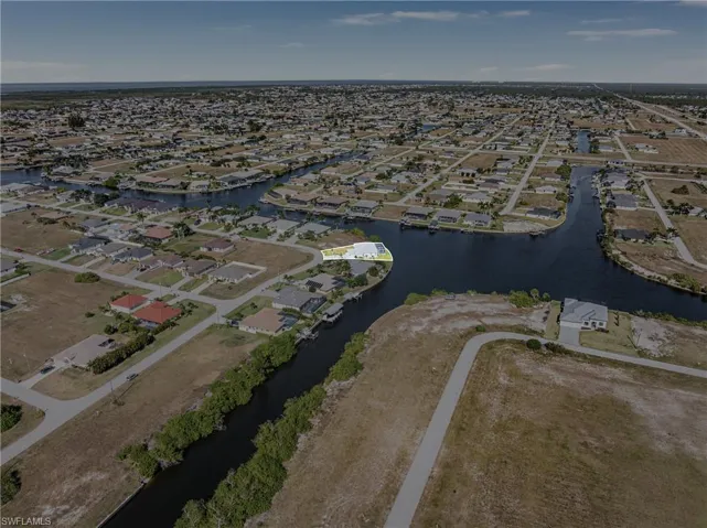 View of property location with nearby suburban area and a nearby body of water