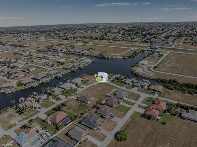 View of property location with nearby suburban area and a large body of water