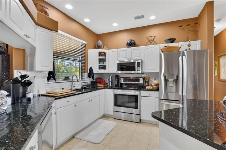 Light and bright kitchen with recessed lighting