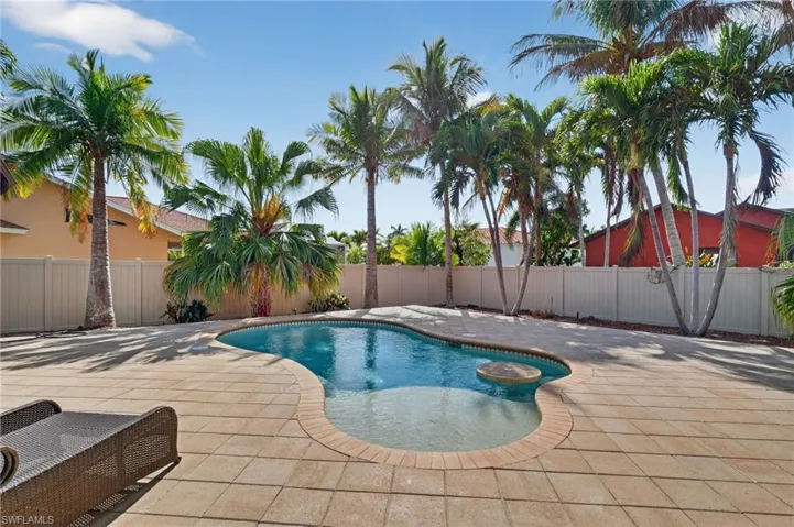 Saltwater pool with fenced yard