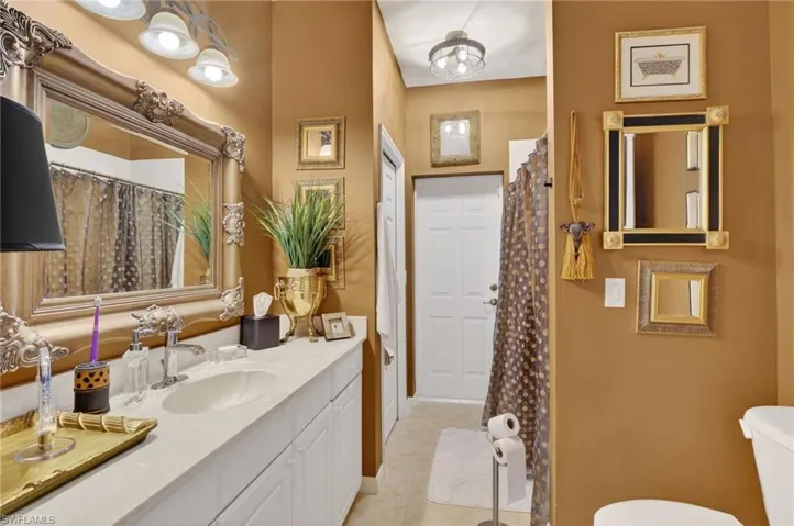 Guest bath leads to pool area