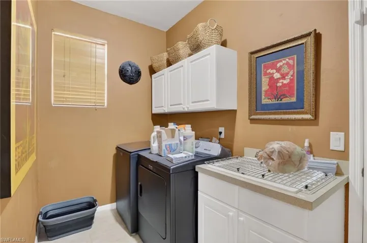 Laundry room with laundry tub & cabinets