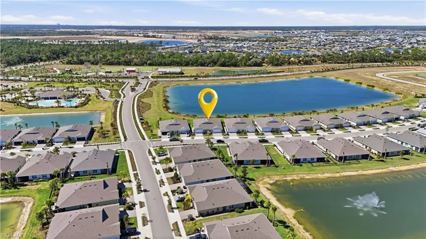 View of property location featuring a nearby body of water and nearby suburban area