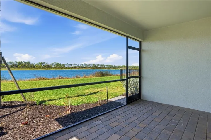 Unfurnished sunroom featuring a water view