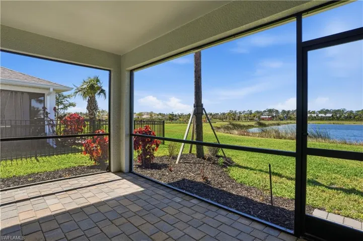Unfurnished sunroom featuring a water view