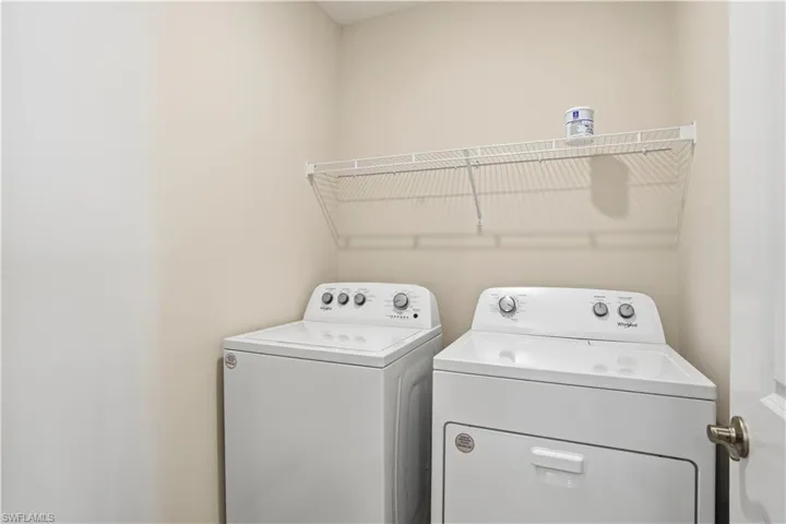 Laundry room featuring washer and clothes dryer