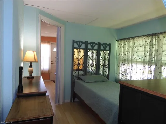 Bedroom with wood-type flooring