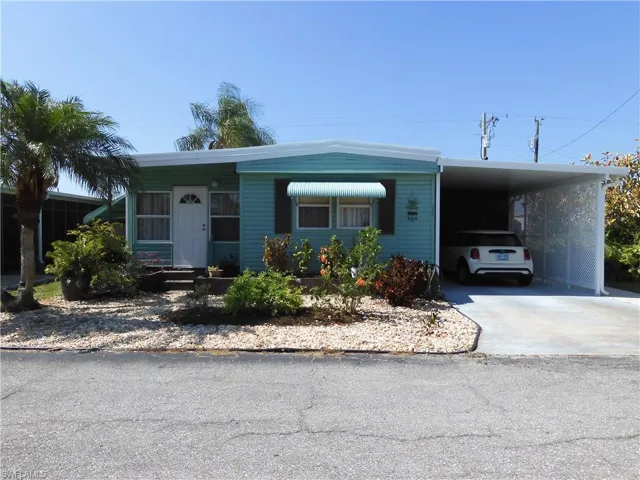 View of front of house featuring a carport