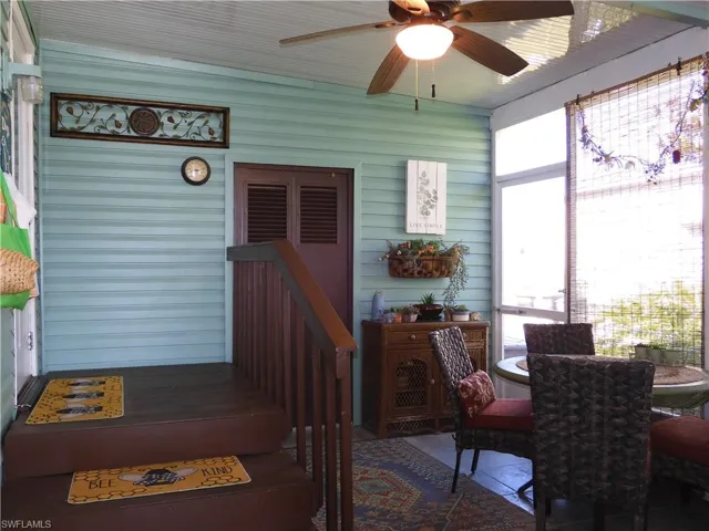 Sunroom featuring ceiling fan