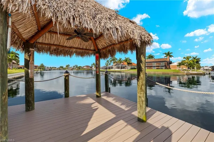 View of dock featuring a gazebo and a water view