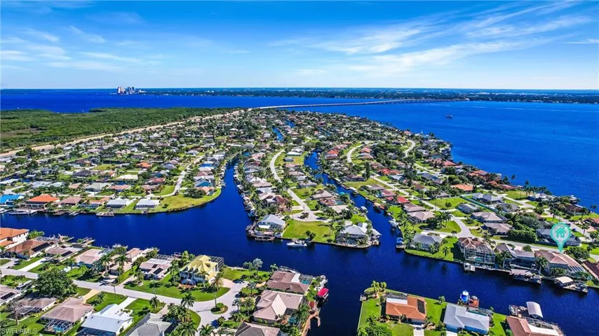 Drone / aerial view with a water view and a residential view