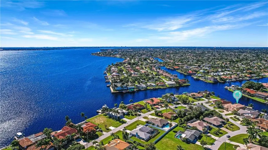 Aerial view featuring a residential view and a water view