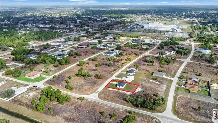 Aerial view of property and surrounding area with property boundaries highlighted