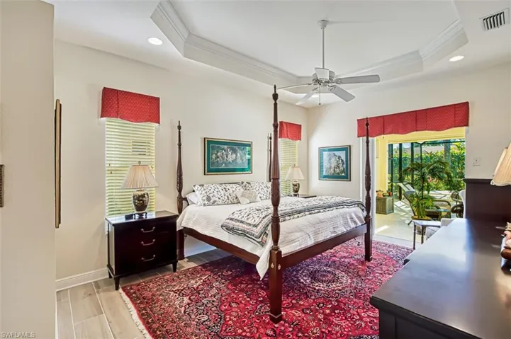 Bedroom with ornamental molding, wood finish floors, access to exterior, a ceiling fan, and recessed lighting