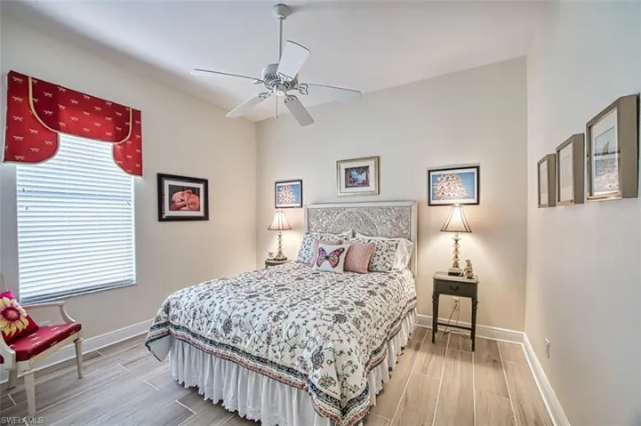 Bedroom featuring wood finish floors and ceiling fan