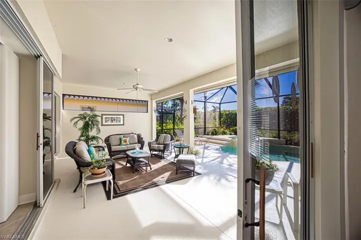 Sunroom / solarium featuring an outdoor hangout area, a ceiling fan, and a patio area