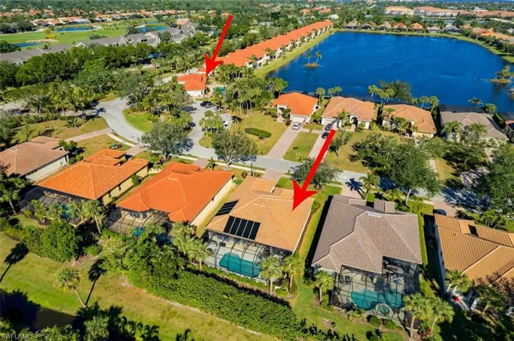 Aerial perspective of suburban area with a nearby body of water