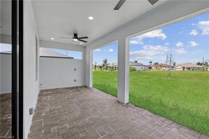 View of patio with ceiling fan