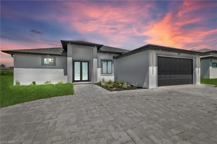 View of front facade featuring a garage