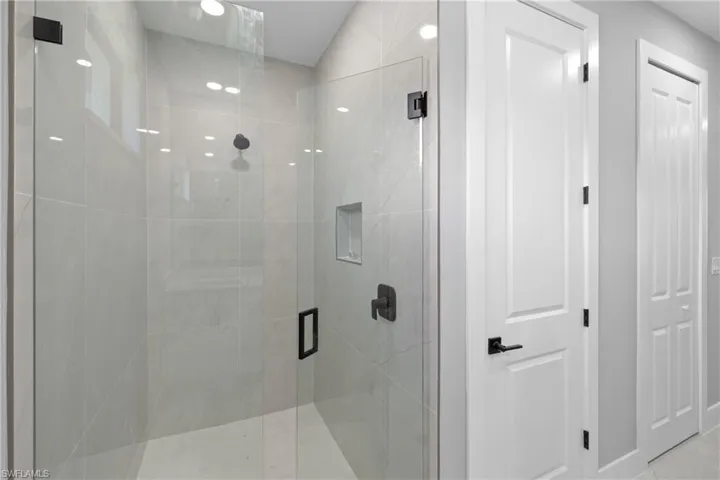 Bathroom featuring walk in shower