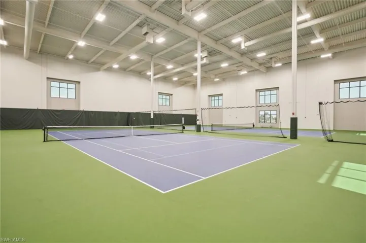 View of tennis court featuring community basketball court