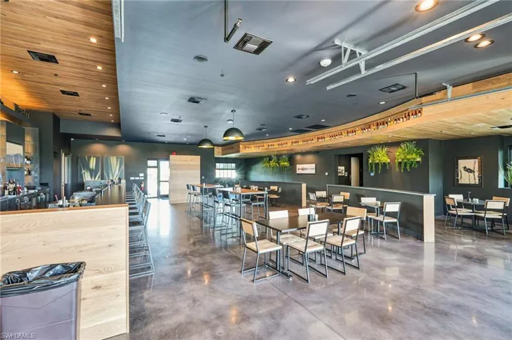Dining room featuring concrete floors and visible vents