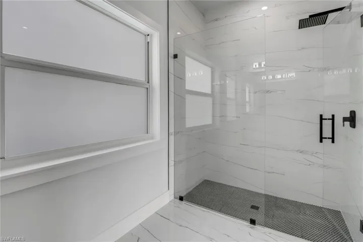 Bathroom featuring an enclosed shower