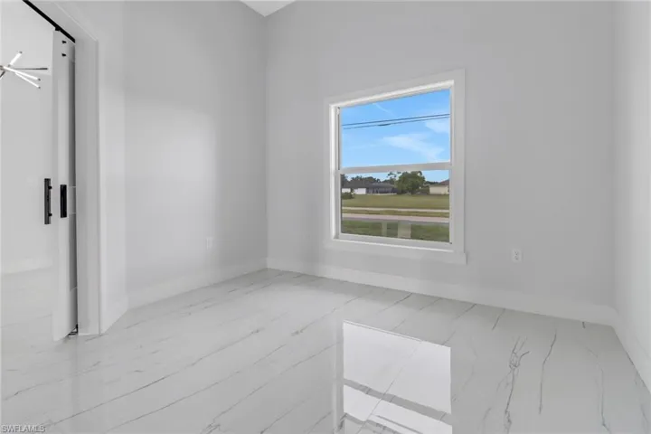 Spare room with light tile patterned floors
