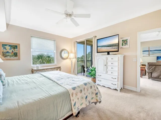 Master bedroom featuring crown molding, access to outside, carpet, and ceiling fan