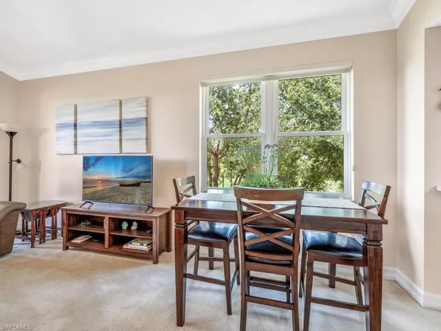 Dining space featuring crown molding