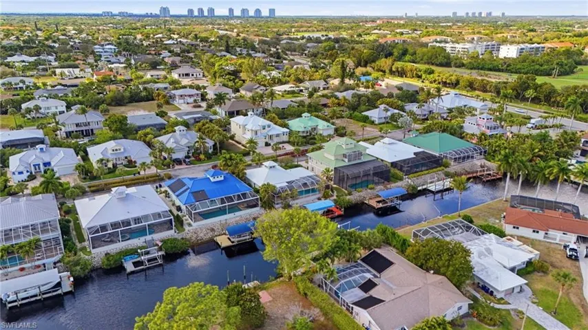 Aerial view of residential area with skyline and a large body of water