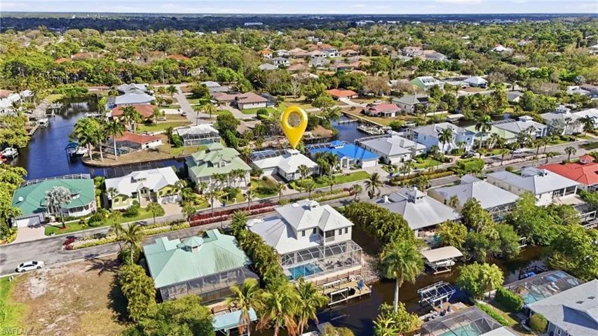 Aerial perspective of suburban area with a large body of water