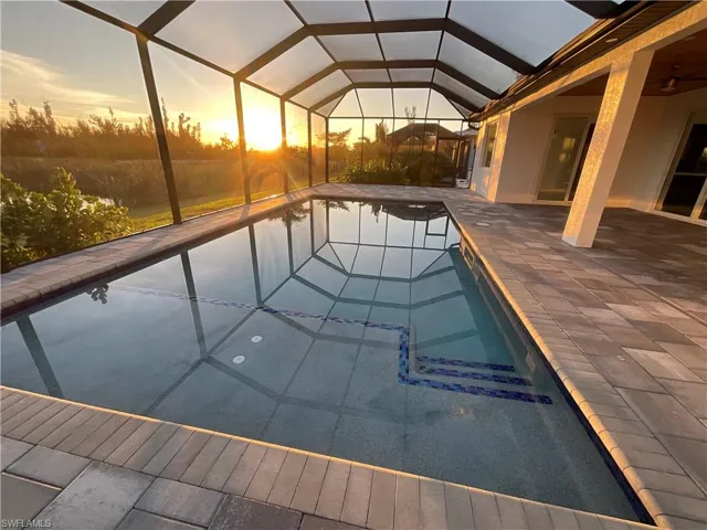 View of pool at dusk