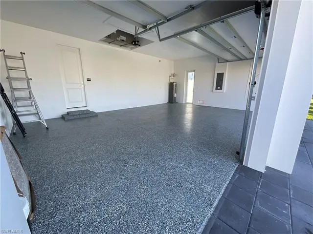 Garage with electric water heater and electric panel