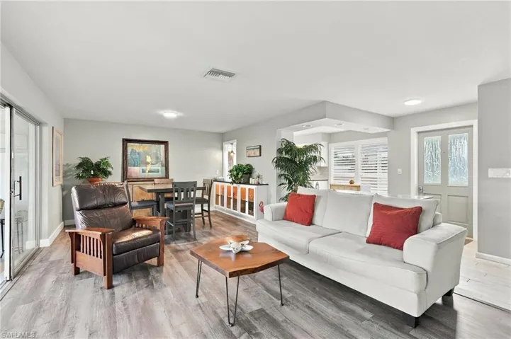 Wood-finish flooring throughout, with a recessed lighting fixture