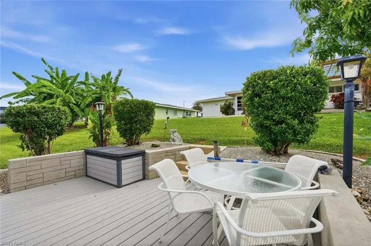 Outdoor deck with seating area right off your gulf access canal