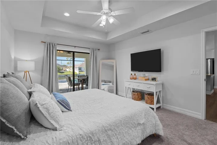 master bedroom with sliders to lanai