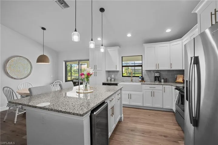 oversized island and stainless steel appliances